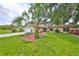 House exterior with palm tree and green lawn at 1606 Alder Way, Brandon, FL 33510