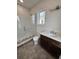 Modern bathroom featuring a walk-in shower, designer tile and stylish vanity, all in a clean, bright setting at 4021 W Santiago St, Tampa, FL 33629