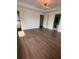 Spacious bedroom featuring wood floors and a decorative chandelier, providing a luxurious feel at 4021 W Santiago St, Tampa, FL 33629