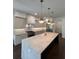 Bright, airy kitchen features an island, modern appliances and light gray cabinets at 4021 W Santiago St, Tampa, FL 33629