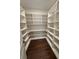 Walk-in pantry with extensive shelving, offering plenty of storage space for all your kitchen essentials at 4021 W Santiago St, Tampa, FL 33629