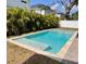 Inviting backyard pool with a tanning ledge, perfect for relaxation and enjoyment at 4021 W Santiago St, Tampa, FL 33629