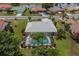 Aerial view of single-Gathering home with pool and landscaped yard at 1725 Wolf Laurel Dr, Sun City Center, FL 33573