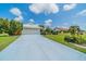 House exterior showcasing the driveway and landscaping at 1725 Wolf Laurel Dr, Sun City Center, FL 33573