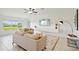 Living room featuring comfortable seating, a large TV, and a water view at 13265 Great Plains Dr, Riverview, FL 33579