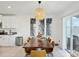 Bright dining room with a live-edge wood table and modern chairs at 13265 Great Plains Dr, Riverview, FL 33579