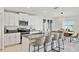 Modern kitchen with island, white cabinets and stainless steel appliances at 13265 Great Plains Dr, Riverview, FL 33579
