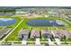 Community overview featuring a lake and numerous houses at 13265 Great Plains Dr, Riverview, FL 33579