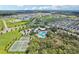 Aerial view of community including pool and tennis courts at 13265 Great Plains Dr, Riverview, FL 33579