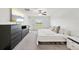 Main bedroom with large bed, dresser and window with view at 13265 Great Plains Dr, Riverview, FL 33579