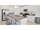 Island kitchen with stainless steel appliances and granite countertops at 13265 Great Plains Dr, Riverview, FL 33579