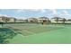 Well-maintained tennis court with benches and fencing at 13265 Great Plains Dr, Riverview, FL 33579