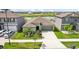 House exterior with a two-car garage and curb appeal at 13265 Great Plains Dr, Riverview, FL 33579