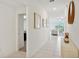 Bright hallway with tile floors and views into living room and bedroom at 13265 Great Plains Dr, Riverview, FL 33579