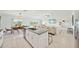 Open concept kitchen features a large island and breakfast bar at 13265 Great Plains Dr, Riverview, FL 33579