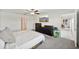 Main bedroom with large bed, dresser and access to bathroom and dining area at 13265 Great Plains Dr, Riverview, FL 33579