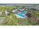 Community pool, tennis courts, and clubhouse aerial view at 13265 Great Plains Dr, Riverview, FL 33579