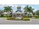 Community clubhouse with palm trees and landscaping at 13265 Great Plains Dr, Riverview, FL 33579
