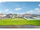 Large backyard with pond view and privacy fence at 13265 Great Plains Dr, Riverview, FL 33579