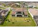 Aerial view showcasing home's backyard and landscaping at 8834 Sanders Tree Loop, Wesley Chapel, FL 33545