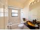 Bathroom featuring a tub with a shower, a vanity with a sink, and a window at 11416 Billingham Blvd, Spring Hill, FL 34609