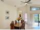 Dining area with wood table and chairs, view into kitchen at 11416 Billingham Blvd, Spring Hill, FL 34609