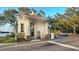A close-up of the well-maintained guard house at the gated entrance at 11416 Billingham Blvd, Spring Hill, FL 34609