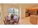 Bright kitchen with wood cabinets, breakfast nook, and view to backyard at 11416 Billingham Blvd, Spring Hill, FL 34609