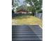 Private backyard with a deck and fenced in area at 5238 16Th St, Zephyrhills, FL 33542