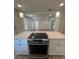 Modern kitchen featuring stainless steel appliances and white cabinetry at 5238 16Th St, Zephyrhills, FL 33542