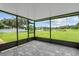 Screened porch overlooking a pond and grassy backyard at 212 Excalibur Ct, Brandon, FL 33511