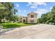 Two-story house with a large front yard and circular driveway at 212 Excalibur Ct, Brandon, FL 33511