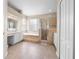 Elegant bathroom with double vanity, soaking tub, and shower at 212 Excalibur Ct, Brandon, FL 33511