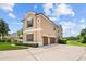 Two-story house with attached garage and landscaped yard at 212 Excalibur Ct, Brandon, FL 33511
