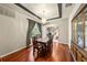 Elegant dining room with hardwood floors, a chandelier, and built-in hutch at 212 Excalibur Ct, Brandon, FL 33511