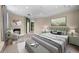 Bright main bedroom featuring a fireplace and sitting area at 212 Excalibur Ct, Brandon, FL 33511