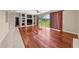 Large living room with hardwood floors and built-in shelving at 212 Excalibur Ct, Brandon, FL 33511