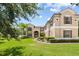 Two-story house with a large front yard and circular driveway at 212 Excalibur Ct, Brandon, FL 33511