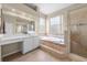 Spa-like bathroom with soaking tub and walk-in shower at 212 Excalibur Ct, Brandon, FL 33511