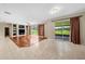 Spacious living area with hardwood floors and sliding glass doors leading to the backyard at 212 Excalibur Ct, Brandon, FL 33511