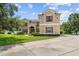 Two-story house with a large front yard and circular driveway at 212 Excalibur Ct, Brandon, FL 33511