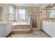 Clean bathroom with double vanity, garden tub, and shower at 212 Excalibur Ct, Brandon, FL 33511