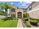 Two-story house with columns and landscaping at 212 Excalibur Ct, Brandon, FL 33511