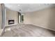 Light-filled living room with a cozy fireplace at 212 Excalibur Ct, Brandon, FL 33511