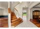 Elegant entryway with hardwood floors and staircase at 212 Excalibur Ct, Brandon, FL 33511