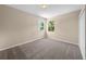 Simple bedroom with neutral walls and carpet at 212 Excalibur Ct, Brandon, FL 33511