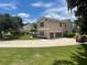 Two-story house with attached garage, landscaping, and circular driveway at 212 Excalibur Ct, Brandon, FL 33511