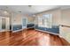 Long hallway with hardwood floors and decorative trim at 212 Excalibur Ct, Brandon, FL 33511