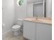 Clean bathroom with single vanity, toilet and beige countertop at 212 Excalibur Ct, Brandon, FL 33511