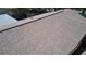 High-angle view of a house roof with brown and beige shingles at 7101 Green St, New Port Richey, FL 34652